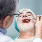 Dentist examining patient's teeth during dental examination in Jacksonville office.