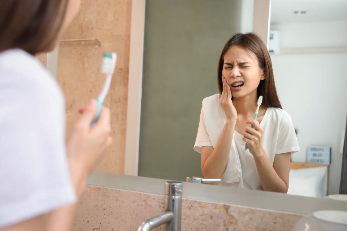 Signs of gum disease including bleeding gums during brushing