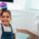 Happy child holding colorful toy in Jacksonville pediatric dental office.
