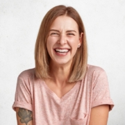 Woman smiling while considering clear aligner treatment in Jacksonville, NC