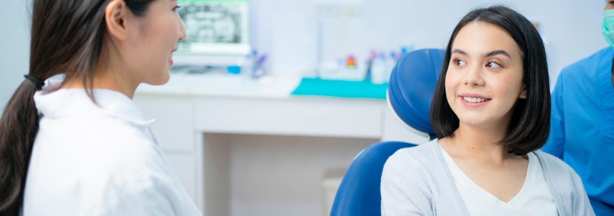 Patient discussing Invisalign candidacy with a dentist in Jacksonville, NC