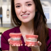 Woman comparing traditional braces with orthodontic treatment options in Jacksonville, NC